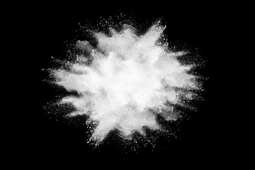 White powder or flour explosion isolated on black background.