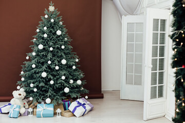 New Year's Red Christmas Tree decor with gifts and garlands interior