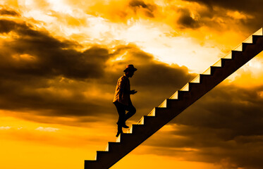 Fototapeta na wymiar Mystic scene, Silhouette wanderer guy confident step up on a heaven stairway going up to the sky. Freedom of choice concept. Opportunity stair way, after life concept