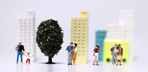 A variety of miniature people wearing masks. Concepts about the importance of wearing masks in everyday life.
