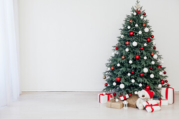Christmas tree decor with gifts and garlands interior new year