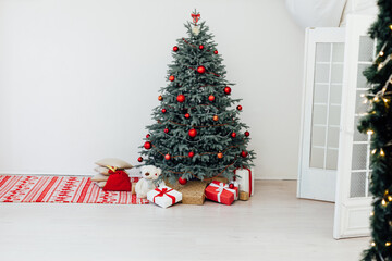 Christmas tree decor pine with gifts and garlands interior new year