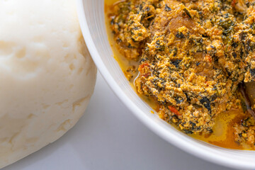 Bowl of Pounded Yam served with Egusi - Melon Soup