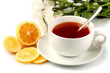 Hot drink with a lemon and flowers