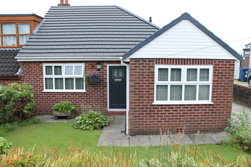 English house with small front garden, bungalow single story - 394078227