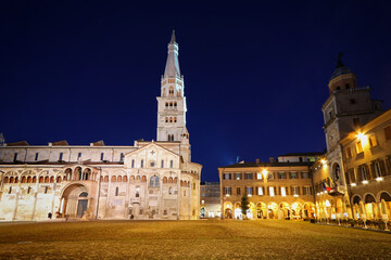 Fototapeta na wymiar Modena, night view of Piazza Grande, Modena city, Duomo and Ghirlandina tower, Unesco world heritage site