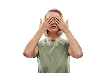 The blonde woman covered her eyes with her hands. Social phobia and problems. Isolated on white...