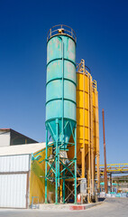 Old rusted towers on chemical plant