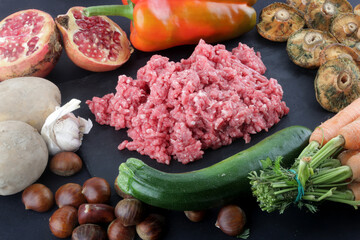 raw minced meat with fungus paprika zucchini and carrots
