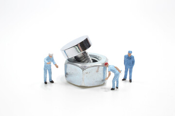 a mini people working on nut at board
