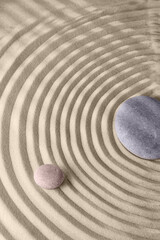 Fototapeta na wymiar Circles on the sand and round stones in the rock garden, for relaxation and spiritual harmony