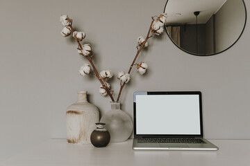 Blank screen laptop. Home office desk table workspace. Modern hygge interior design. Copy space mockup template. Front view freelancer, blogger work business concept.