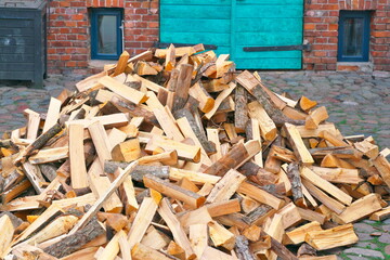 Chopped firewood for the stove near the house.