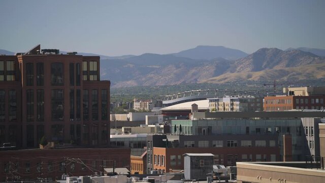 beautiful shot of downtown city with mountains in background