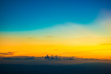 Fototapeta na wymiar Colorful cumulus sunset sky clouds with sun setting down