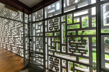 Beautiful floor to ceiling window with wooden floor and modernist Asian design elements and horizontal format