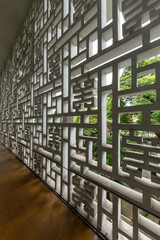 Beautiful floor to ceiling window with wooden floor and modernist Asian design elements and vertical format