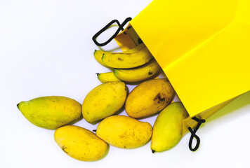 Flay lay of yellow banana and mango