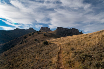 Road up to Peñas de Herrera during sunset from the town of Talamantes, in Aragon, Spain