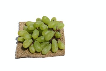 Juicy Grapes on Burlap Fabric Isolated on White Background with Copy Space for Texts Writing