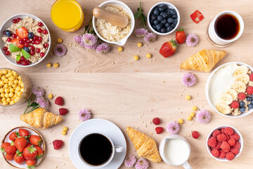 Healthy breakfast set on wooden background. The concept of delicious and healthy food. Mix nuts, honey, berries, orange jus, pancake and milk. Top vi