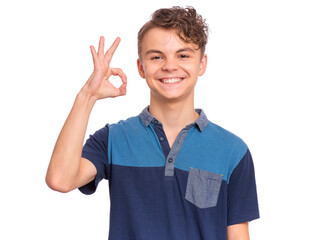 Handsome teen boy laughing looking very happy, isolated on white background.