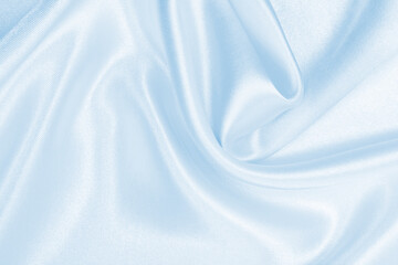 Smooth elegant blue silk or satin luxury cloth texture as abstract background. Luxurious background design