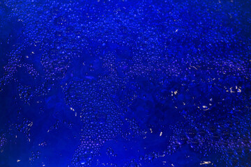 Obraz premium Abstract background blue water in the pool, lots of bubbles in the water
