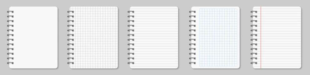 Collection of various white papers notebook for your text. Blank pages of a diary notebook with margins isolated on gray background.