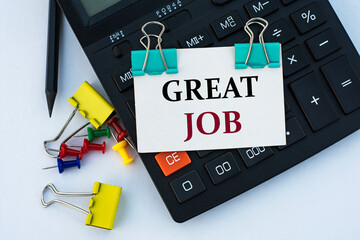 GREAT JOB - words on a white sheet with clips on a white background with a calculator, buttons and...