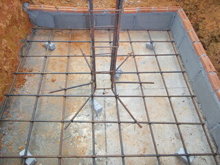 Construction work.Placing concrete foundations. Pouring concrete. Precast concrete products.