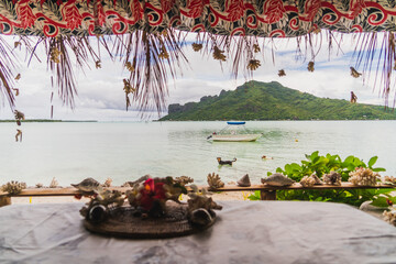 tropical island view with boat in french polynesia island of maupiti 