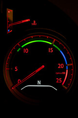 Fototapeta premium Rev counter on the dash of a truck lit up at night.