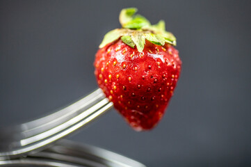 composition with strawberry and forks