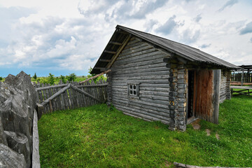 Obraz premium Close up of historic wooden farmstead surrounded by palisade