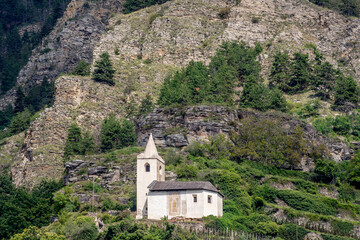 Fototapeta na wymiar St. Egidius is a Roman Catholic church above the village of Kortsch in the municipality of Schlanders in South Tyrol, Italy