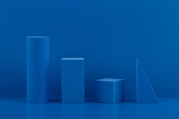 Blue abstract monochromatic background with blue geometrical figures on blue