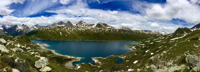 Panoramic view of an alpine lake in Val Formazza, Piedmont, Italy 