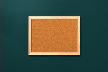 Empty coark board on green tidewater background