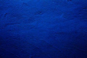 Blue colored abstract wall background with textures of different shades of blue