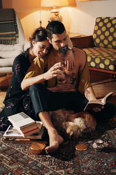 Attractive Young Couple Enjoying Leisure Time Together At Home