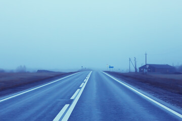 road in fog concept, mist in october halloween landscape, highway