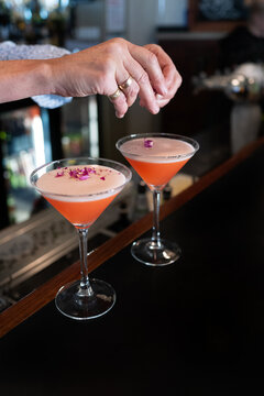 La vie En Rose Martini cocktail being made and served at bar