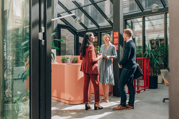 Group of Businesspeople Chatting at Hallway