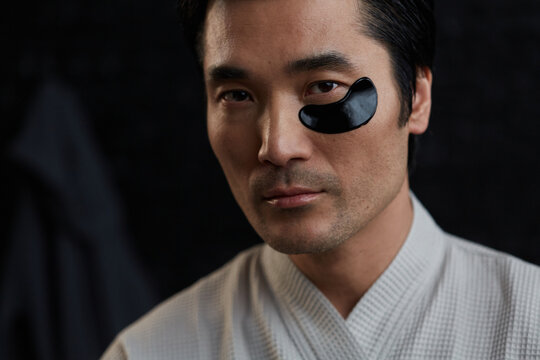 Confident sophisticated adult man at home skincare routine