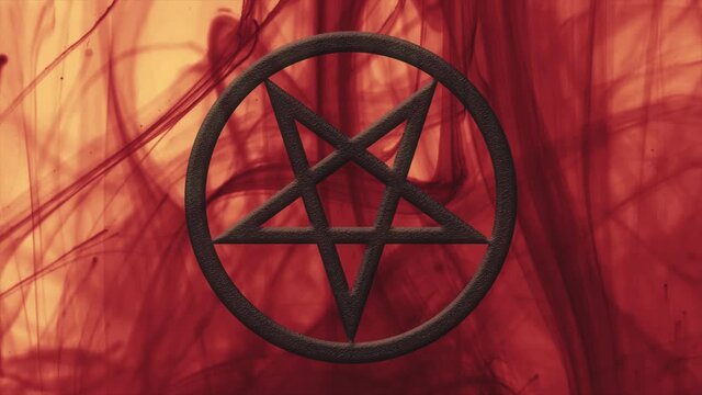 Inverted pentagram close-up. Red ink in motion. Abstract background