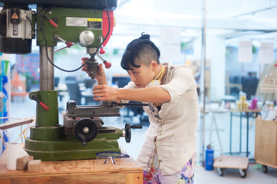 Young adult woman in Maker space