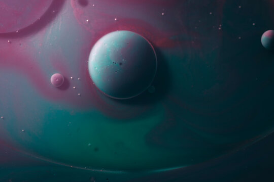 Cell on abstract green and purple background