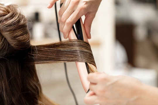 Young woman using the services of a hairstyle saloon.