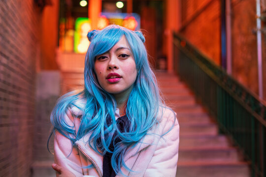 Young Asian Woman on streets at evenng